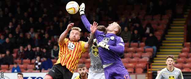 Partick Thistle's Ryan Stevenson challenges for the ball with Mark Ridgers