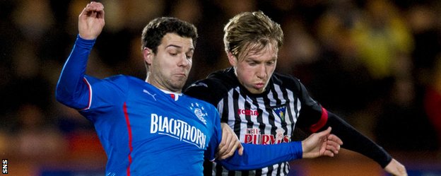 Rangers' Richard Foster competes with Jordan Moore while the latter was with Dunfermline