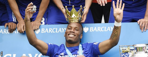 Didier Drogba celebrates with the Premier League trophy