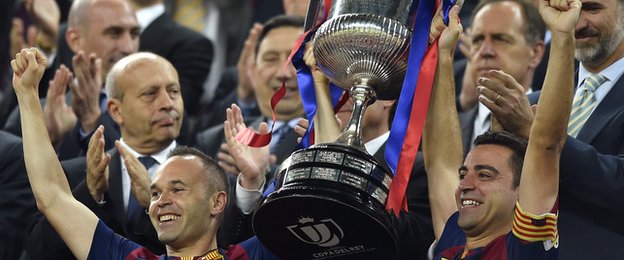 Xavi lifts the Copa Del Rey with Andres  Iniesta