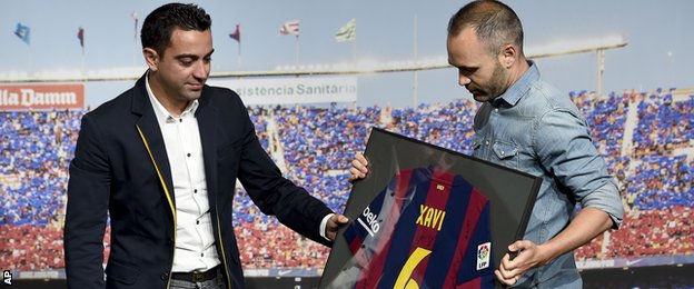 Xavi (left) and Andres Iniesta