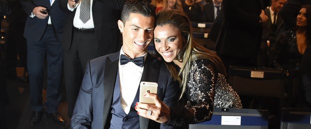 Marta, runner-up for the women's Ballon d'Or award in 2014, poses for a selfie with men's winner Cristiano Ronaldo