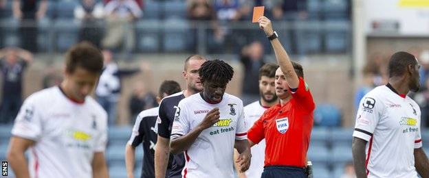 Inverness forward Andrea Mbuyi-Mutombo is sent off by Andrew Dallas at Dens Park