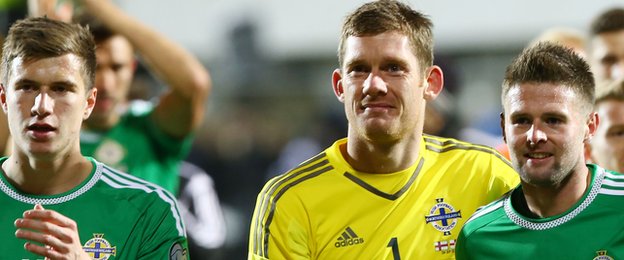 Patrick McNair, Michael McGovern and Oliver Norwood celebrate after Northern Ireland's 3-1 win over the Faroe Islands