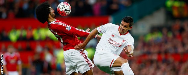 Marouane Fellaini (L) and Dejan Lovren (R)